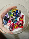 Pop culture themed glass milli pendants