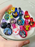 Pop culture themed glass milli pendants